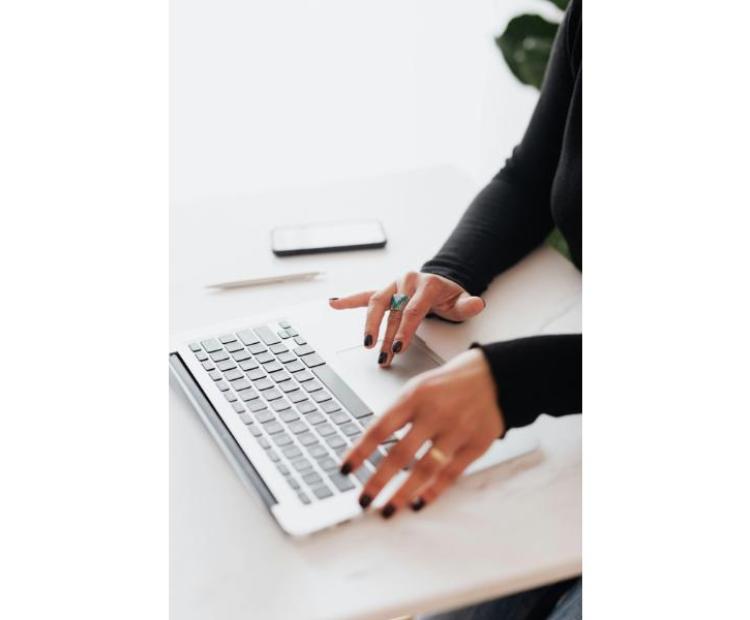 A girl typing on keyboard
