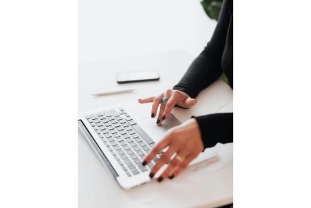 A girl typing on keyboard